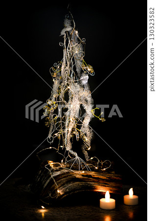Christmas tree table handmade arrangement mini decoration for new year artificial on black background isolated Christmas tree table handmade arrangement mini decoration for new year artificial on black background isolated 130323582
