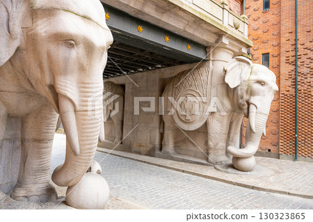 The Elephant Gate features striking stone sculptures of elephants that welcome visitors to the brewery in Copenhagen, Denmark. This architectural marvel blends art and history beautifully. The Elephant Gate features striking stone sculptures of elephants that welcome visitors to the brewery in Copenhagen, Denmark. This architectural marvel blends art and history beautifully. 130323865