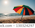 Multicolored Sun Umbrella at Angle on Beach 130324297