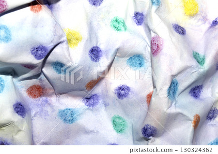 Crumpled paper with children's pencil crayon spotty polka dots background 130324362