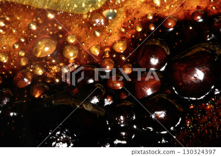 Close up of bubbling oil and fat grilled abstract food backgrouond 130324397