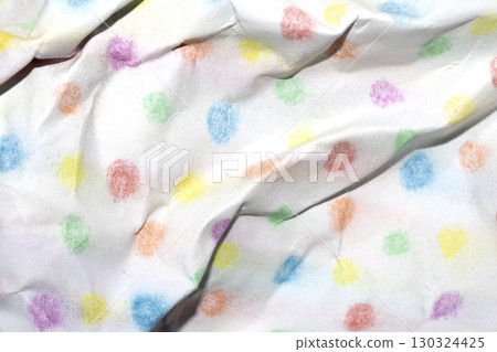 Crumpled paper with children's pencil crayon spotty polka dots background 130324425