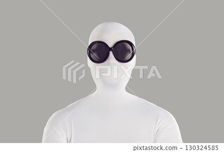 Portrait of a person disguised in a white spandex bodysuit and black round sunglasses Portrait of a person disguised in a white spandex bodysuit and black round sunglasses 130324585