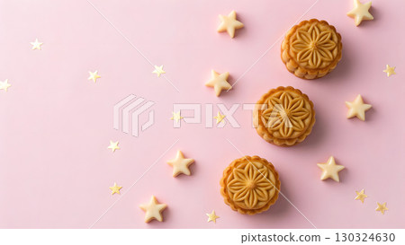Festive cookies and stars arranged on a pink background for a delightful celebration 130324630