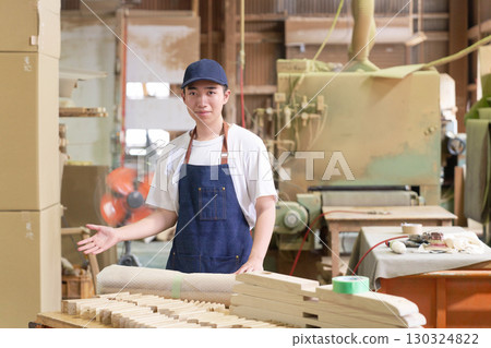 Young people working at a furniture manufacturing site Young people working at a furniture manufacturing site 130324822