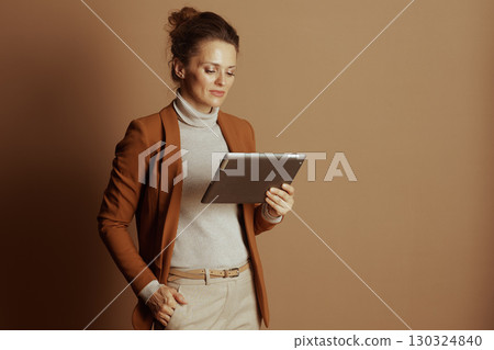 Focused Businesswoman Using Digital Tablet 130324840