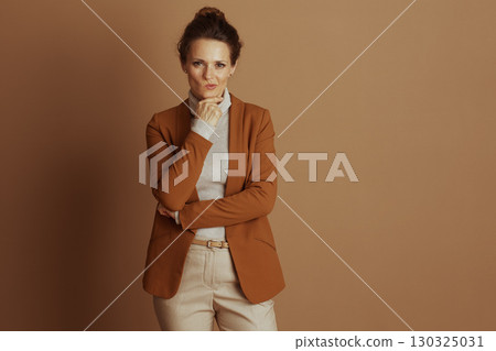 Pensive Businesswoman with Hand on Chin Pensive Businesswoman with Hand on Chin 130325031