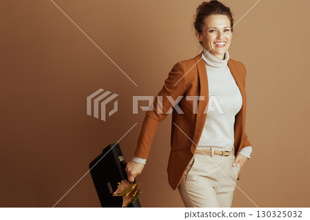 Confident Professional with Briefcase and Autumn Style Confident Professional with Briefcase and Autumn Style 130325032