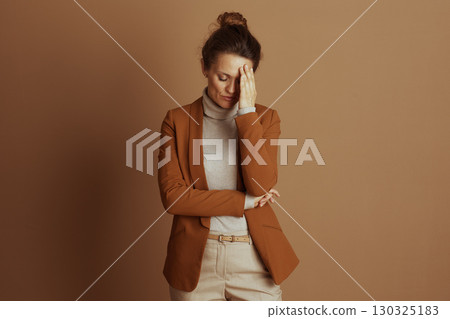 Stressed Businesswoman with Hand on Forehead Stressed Businesswoman with Hand on Forehead 130325183
