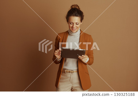 Focused Professional Woman Using Digital Tablet Focused Professional Woman Using Digital Tablet 130325188