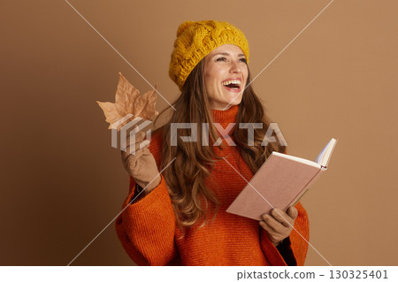 Joyful Autumn Reading with Leaf and Open Book Joyful Autumn Reading with Leaf and Open Book 130325401