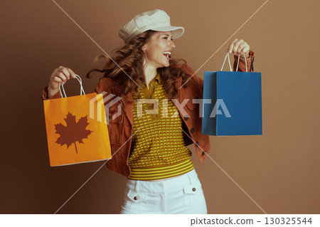 Dynamic Young Woman with Autumn Purchases 130325544