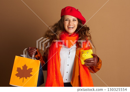 Excited Woman with Autumn Shopping & Savings Excited Woman with Autumn Shopping & Savings 130325554