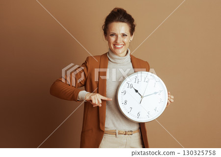 Businesswoman Emphasizing Punctuality and Time 130325758