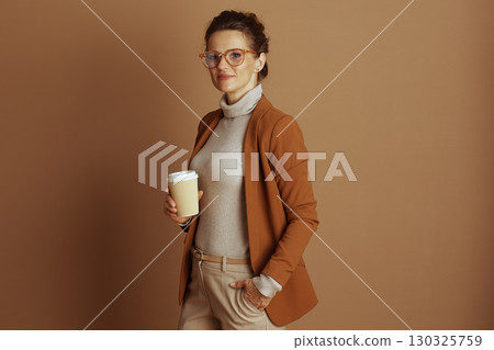 Approachable Professional Woman with Coffee Cup 130325759