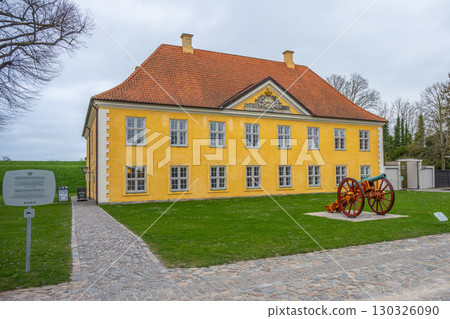 Located in Copenhagen, the Commander's House of Kastellet features a distinctive yellow facade and historical cannon. The site offers insight into Denmark's military past amidst scenic surroundings. Located in Copenhagen, the Commander's House of Kastellet features a distinctive yellow facade and historical cannon. The site offers insight into Denmark's military past amidst scenic surroundings. 130326090