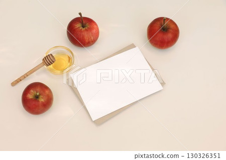 Flat lay of red apples, honey, wooden dipper. Blank greeting card, invitation mockup on white table background in sunlight. Bright seasonal still life. Autumn, Rosh Hashanah, Thanksgiving holiday. Top Flat lay of red apples, honey, wooden dipper. Blank greeting card, invitation mockup on white table background in sunlight. Bright seasonal still life. Autumn, Rosh Hashanah, Thanksgiving holiday. Top 130326351