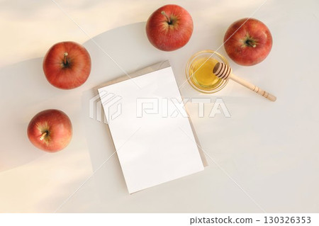 Fresh red apples, bowl of honey, wooden dipper. Blank greeting card, invitation mockup. Beige table in sunlight. Fall seasonal still life. Rosh Hashanah holiday, Thanksgiving, autumn. Flatlay, top Fresh red apples, bowl of honey, wooden dipper. Blank greeting card, invitation mockup. Beige table in sunlight. Fall seasonal still life. Rosh Hashanah holiday, Thanksgiving, autumn. Flatlay, top 130326353