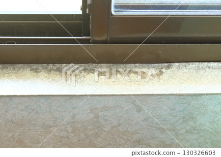 Mold stains on the wall paper near the window Mold stains on the wall paper near the window 130326603
