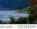 A leisurely sightseeing train running along the Seto Inland Sea 130326609