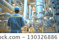 Industrial engineer taking notes while inspecting electrical panel in factory 130326886