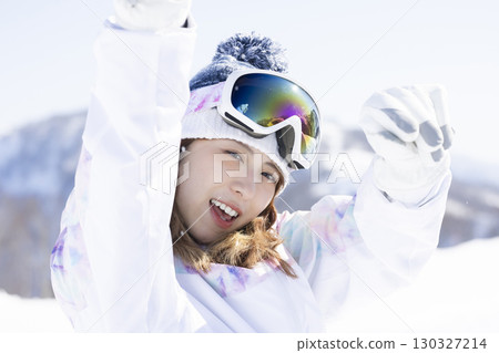 Cute woman enjoying the snow 130327214