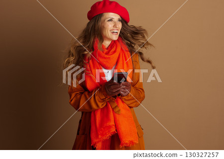 Happy Woman with Smartphone, Windswept Autumn Style Happy Woman with Smartphone, Windswept Autumn Style 130327257