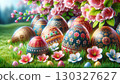 collection of beautifully decorated Easter eggs, each adorned with intricate patterns and floral designs, rests on lush green grass. Surrounding the eggs are delicate spring flowers in full bloom 130327627