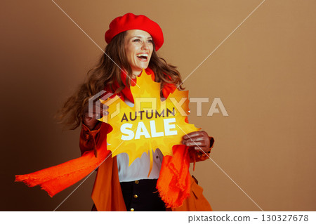 Lively Woman Promoting Autumn Sale Event 130327678
