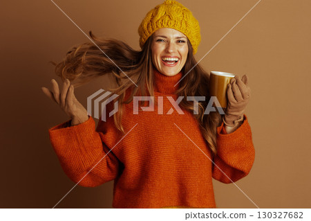 Vibrant Woman Laughing with Warm Autumn Mug Vibrant Woman Laughing with Warm Autumn Mug 130327682