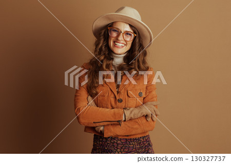 Confident Woman in Autumn Attire with Crossed Arms Confident Woman in Autumn Attire with Crossed Arms 130327737