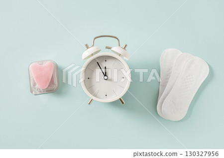 Female different tampons, daily pads, clock. Limited time use concept. 130327956