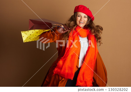Dynamic Shopper in Orange Coat with Autumn Bags 130328202