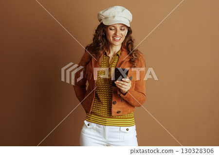 Happy Woman Using Smartphone with Earbuds 130328306