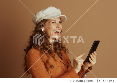 Woman Gesturing Towards Smartphone Screen Woman Gesturing Towards Smartphone Screen 130328463