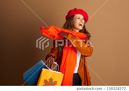 Joyful Woman Laughing with Autumn Shopping Bags 130328572