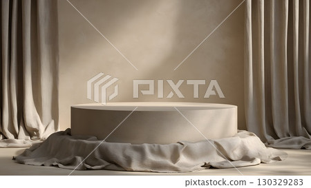 A circular clay platform is surrounded by soft, draped linen fabric in an earthy, natural setting. The background features a warm, organic texture. 130329283