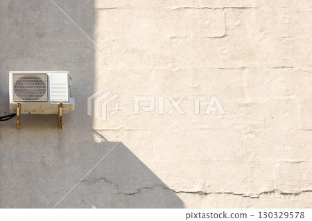 air conditioner is mounted on wall. technologies for air cooling in hot weather. air temperature 130329578
