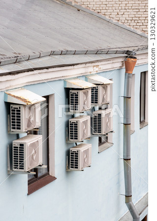 air conditioners are installed on the wall of the building. cooling in hot weather. 130329621