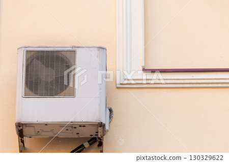 air conditioner is mounted on wall. technologies for air cooling in hot weather. air temperature air conditioner is mounted on wall. technologies for air cooling in hot weather. air temperature 130329622