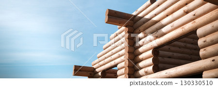 Wooden house building, house made of rounded logs, ecological house 130330510