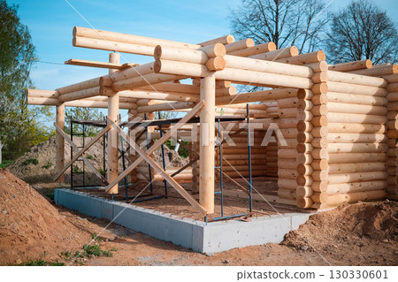 Wooden house building, house made of rounded logs, ecological house 130330601