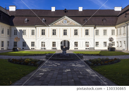 Kohary Palace in Svaty Anton, Slovakia, featuring a courtyard with a fountain and manicured lawn Kohary Palace in Svaty Anton, Slovakia, featuring a courtyard with a fountain and manicured lawn 130330865