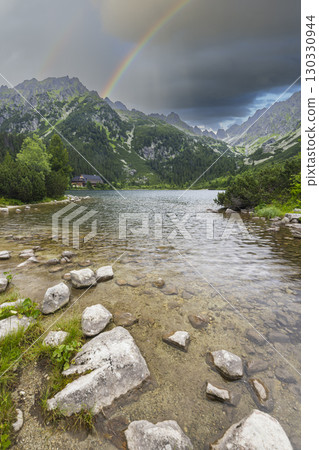 Rainbow over Popradske pleso mountain lake in High Tatras, Slovakia Rainbow over Popradske pleso mountain lake in High Tatras, Slovakia 130330944
