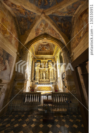 Exploring the priory church of La Benisson Dieu in France, showcasing its altar and frescoes 130330951