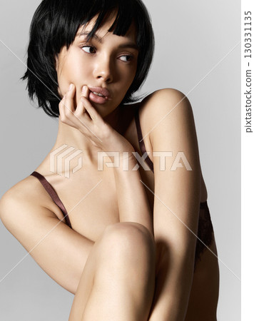 beautiful sexy girl with black bob hair. pretty young woman 130331135