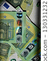 Euro banknote display with spectrum pattern across multiple denominations, showcasing currency features and design elements typical of EU money 130331232