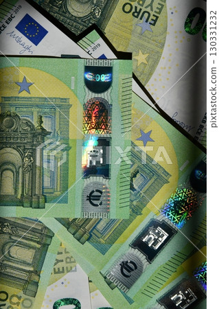 Euro banknote display with spectrum pattern across multiple denominations, showcasing currency features and design elements typical of EU money 130331232