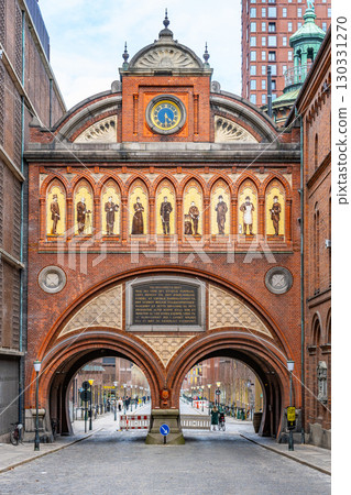 A striking view of the Elephant Gate and Tower showcases unique architectural details in Copenhagen. Visitors can appreciate its intricate designs, historic significance, and surrounding streets. 130331270