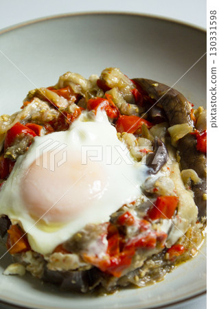 Cooked vegetables with poached egg Cooked vegetables with poached egg 130331598